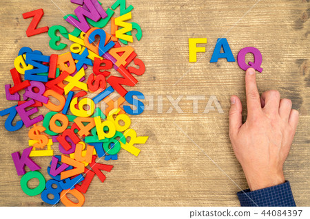 Hand arrange plastic letters as FAQ abbreviation Hand arrange plastic letters as FAQ abbreviation 44084397