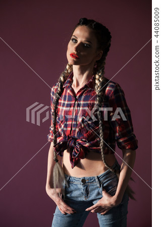 Portrait of a beautiful woman with long braids 44085009