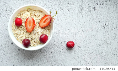 Beautiful female hands lay out on the table a composition of bright berries - 4. Juicy red cherries Beautiful female hands lay out on the table a composition of bright berries - 4. Juicy red cherries 44086243