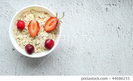 Beautiful female hands lay out on the table a composition of bright berries - 3. Juicy red cherries Beautiful female hands lay out on the table a composition of bright berries - 3. Juicy red cherries 44086255