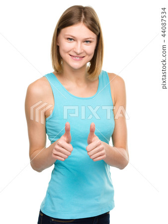 Woman is showing thumb up gesture Woman is showing thumb up gesture 44087534