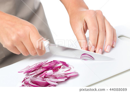 Cook is chopping onion Cook is chopping onion 44088089