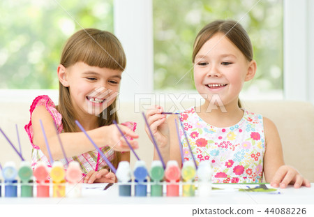 Little girls are painting with gouache 44088226