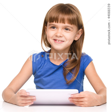 Young cheerful girl is using tablet 44088339