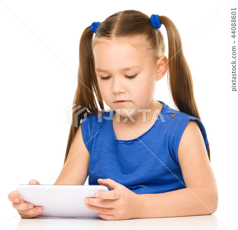 Young girl is using tablet Young girl is using tablet 44088601
