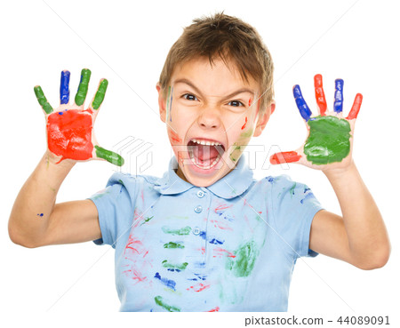 Portrait of a cute boy playing with paints Portrait of a cute boy playing with paints 44089091