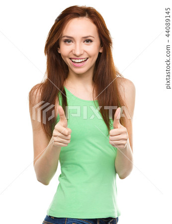 Woman is showing thumb up gesture Woman is showing thumb up gesture 44089145