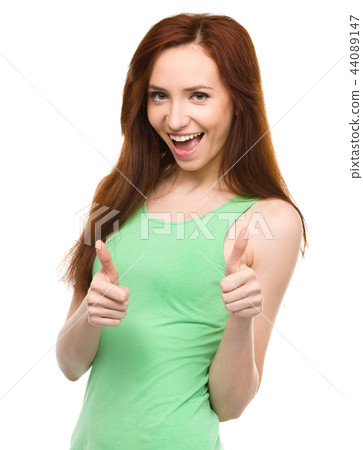 Woman is showing thumb up gesture Woman is showing thumb up gesture 44089147