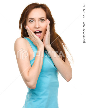 Woman is holding her face in astonishment 44089160
