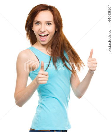 Woman is showing thumb up gesture Woman is showing thumb up gesture 44089164