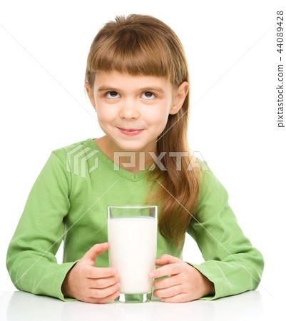 Cute little girl with a glass of milk Cute little girl with a glass of milk 44089428