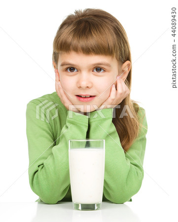 Cute little girl with a glass of milk Cute little girl with a glass of milk 44089430