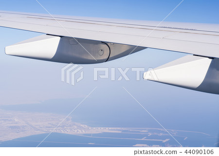 A view from a window in an airplane, wing of an airplane. 44090106