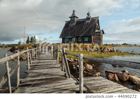 Old russian Orthodox wooden church in the village Rabocheostrovsk, Karelia. Abandoned church on the Old russian Orthodox wooden church in the village Rabocheostrovsk, Karelia. Abandoned church on the 44090272