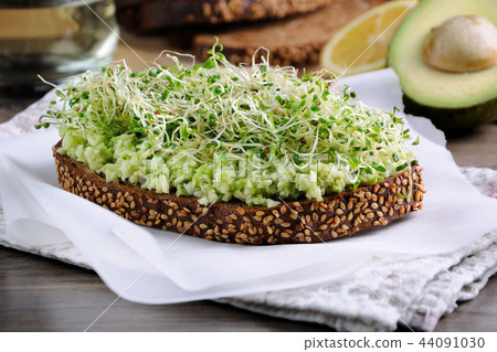 Sandwich with avocado and alfalfa sprouts Sandwich with avocado and alfalfa sprouts 44091030
