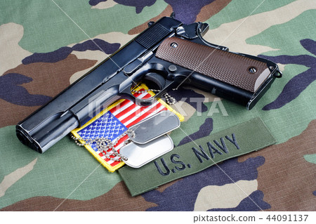 US NAVY branch tape, M1911 handgun with dog tags US NAVY branch tape, M1911 handgun with dog tags 44091137