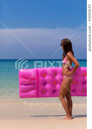 Young slim brunette woman suntan Young slim brunette woman suntan 44092635