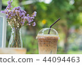 Ice coffee in clear plastic with dry flowers 44094463