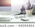 Computer desktop with keyboard and mouse on desk 44094464