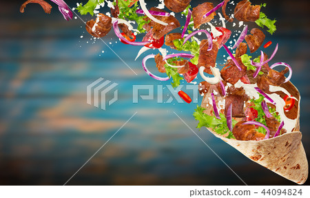 Turkish Kebab yufka with flying ingredients. 44094824