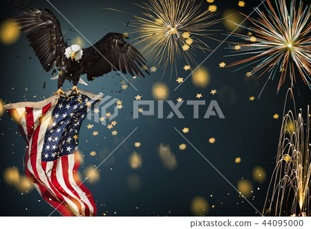 Bald Eagle flying with American flag 44095000