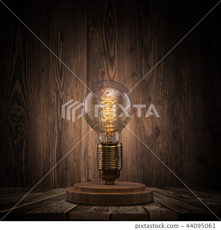 Vintage light bulb on dark background. Vintage light bulb on dark background. 44095061