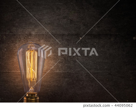 Vintage light bulb on dark background. 44095062
