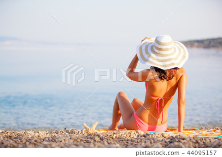 Beautiful woman in bikini at the seaside 44095157