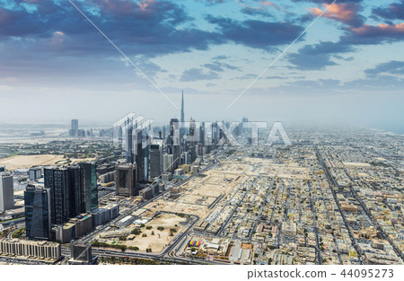 Aerial view of modern skyscrapers and sea in the background in Dubai, UAE. 44095273