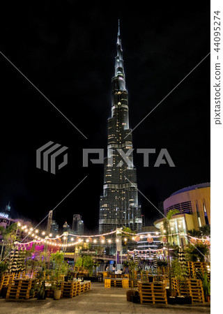 Dubai, United Arab Emirates - May 28 - Night view of Burj Khalifa - the highest building in the world - and lights reflection on the water. 44095274