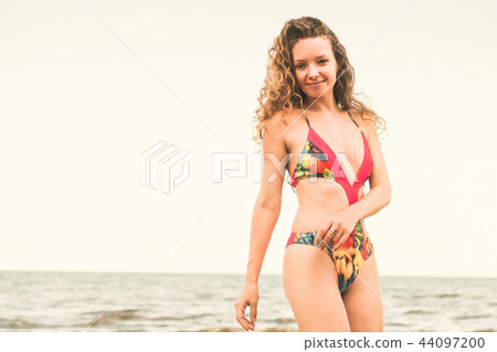 Happy young woman at beach in summer vacation. 44097200