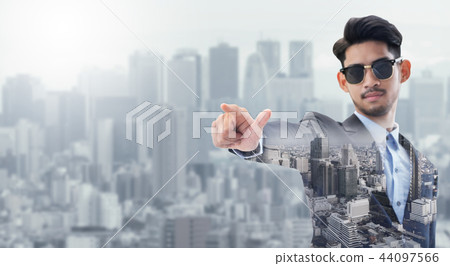 Double exposure businessman pointing at copy space 44097566