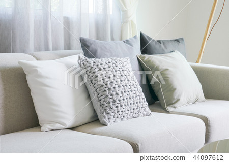 Pillows on beige sofa in the living room Pillows on beige sofa in the living room 44097612