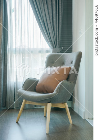 Vintage style armchair at corner of living room Vintage style armchair at corner of living room 44097616