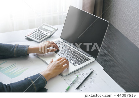 accountant typing message in home office accountant typing message in home office 44097619