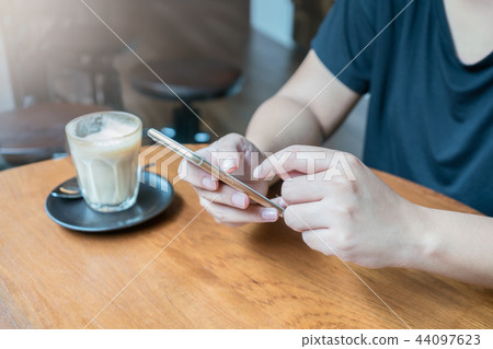 woman hand using smartphone for transaction woman hand using smartphone for transaction 44097623