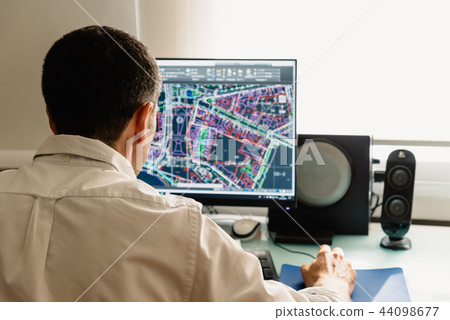 Architect drawing with cad software designing building 44098677