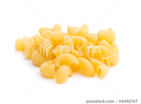 Uncooked elbow macaroni. 44098707