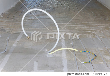 New electricity and gas pipe in a concrete floor 44099174