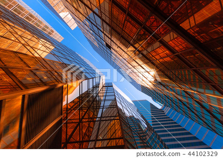 Golden building with blue sky. Windows glass of modern office sk 44102329