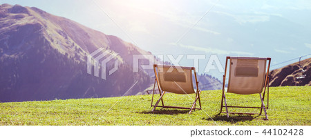 two chairs in the mountains 44102428