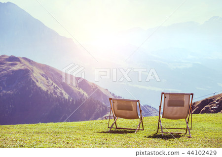 two chairs in the mountains 44102429
