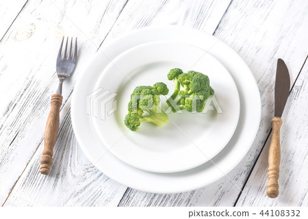 Fresh broccoli on the white plate 44108332