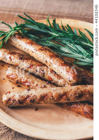 Grilled sausages with rosemary Grilled sausages with rosemary 44108346