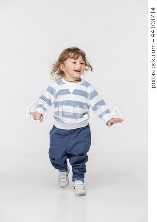 Portrait of happy joyful beautiful little boy, studio shot Portrait of happy joyful beautiful little boy, studio shot 44108714
