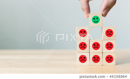 Hand picked wooden block with icon face emotion Hand picked wooden block with icon face emotion 44108864