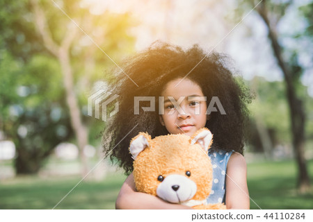 girl hugging teddy bear 44110284