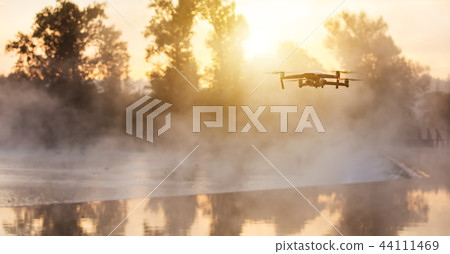 Drone copter with digital camera, blur background 44111469