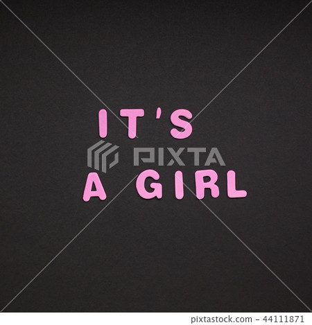 It's a girl writing on black paper background It's a girl writing on black paper background 44111871