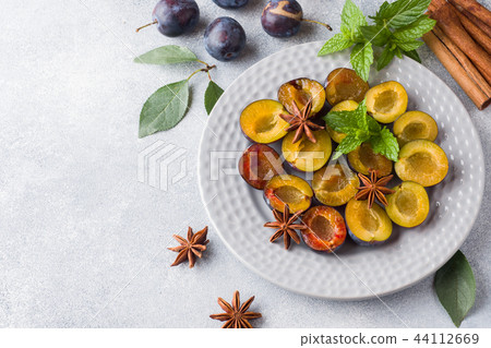 Fresh berries plums in the context of cooking  44112669